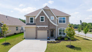 Exterior home renovation of white and brown house